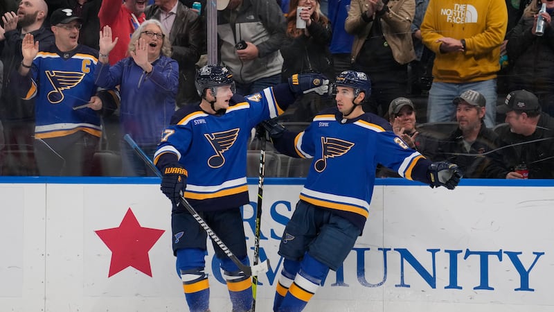 St. Louis Blues' Jordan Kyrou, right, is congratulated by Torey Krug after scoring during the...