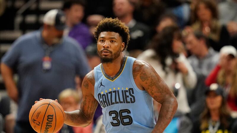 Memphis Grizzlies guard Marcus Smart (36) brings the ball up court during the second half of...