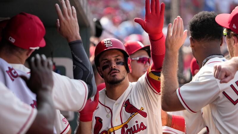 St. Louis Cardinals' Nolan Arenado is congratulated by teammates after hitting a solo home run...