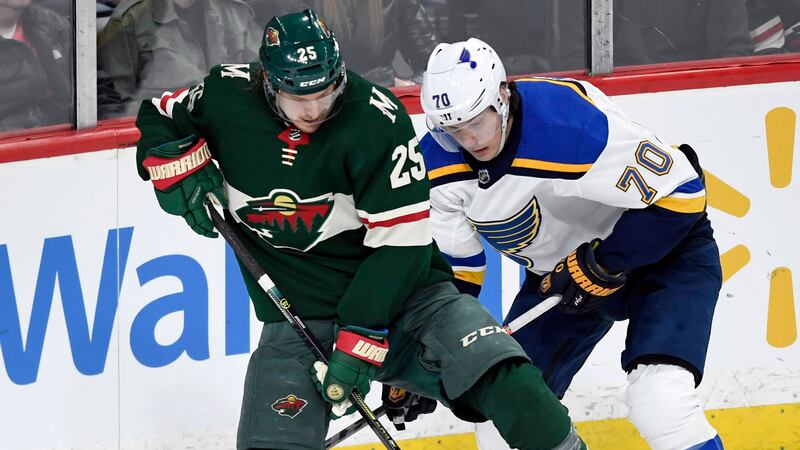 Minnesota Wild's Jonas Brodin (25), of Sweden, has the puck against St. Louis Blues' Oskar...