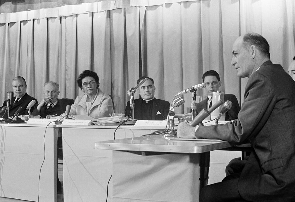 Mississippi Gov. Paul Johnson, right, reads a statement before the U. S. Commission on Civil...