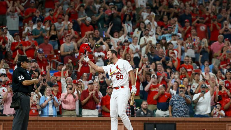 St. Louis Cardinals' Adam Wainwright acknowledges fans as he prepares to pinch hit during the...