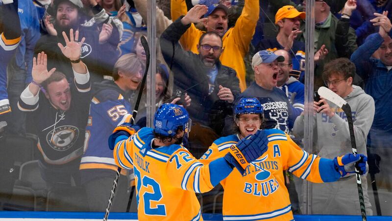St. Louis Blues center Robert Thomas, right, is congratulated by Justin Faulk (72) after...