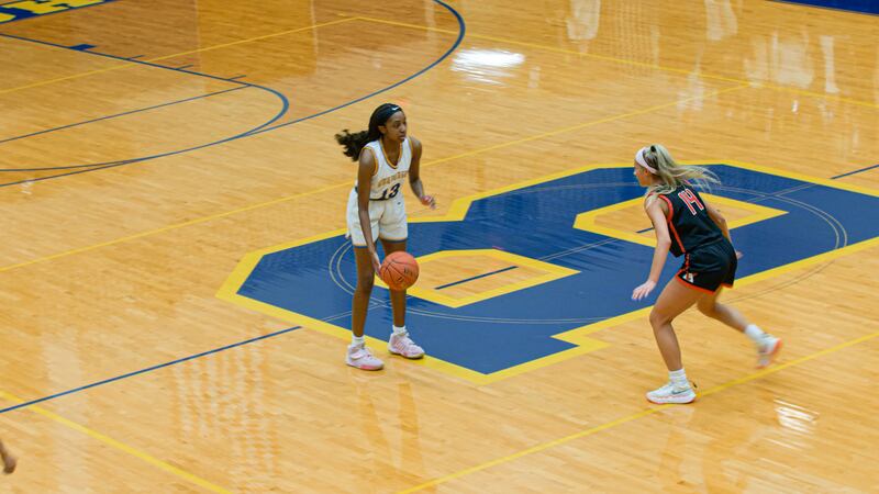 John Burroughs women's basketball player moves the ball up court against Visitation on Friday.