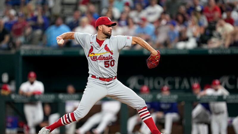 St. Louis Cardinals starting pitcher Adam Wainwright throws to the Texas Rangers in the fifth...