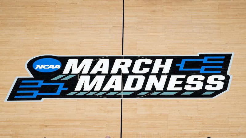 FILE -The March Madness logo is shown on the court during the first half of a men's college...