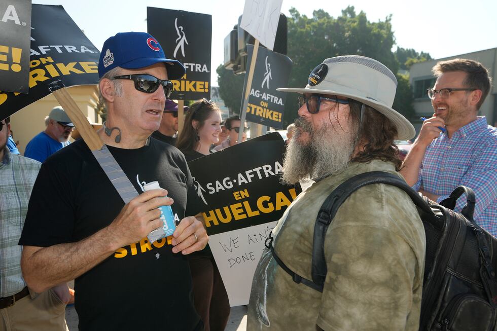 Actors Bob Odenkirk, left, and Jack Black, right, join demonstrators outside the Paramount...