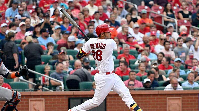St. Louis Cardinals third baseman Nolan Arenado (28) hits a three run home run in the first...