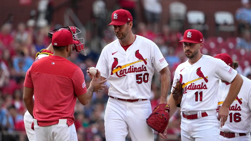 St. Louis Cardinals starting pitcher Adam Wainwright (50) is removed by manager Oliver Marmol,...