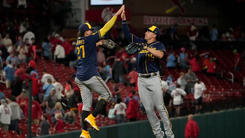Milwaukee Brewers' Willy Adames (27) and Tyrone Taylor (15) celebrate a 3-2 victory over the...