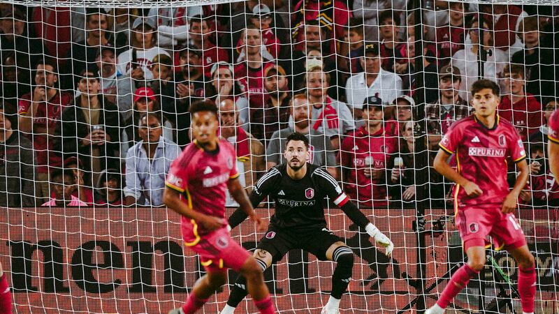 CITY SC goalkeeper Roman Bürki preparing to defend the goal with midfielder Akil Watts and...