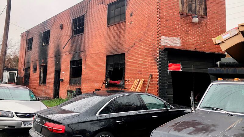 A burned-out warehouse is seen, Tuesday, Dec. 6, 2022, in Baltimore. A man was found dead...