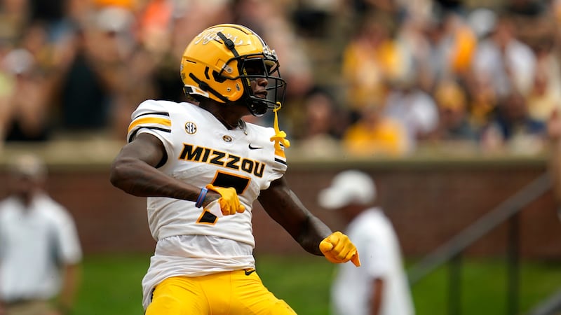 Missouri wide receiver Dominic Lovett celebrates after scoring on a 13-yard touchdown...