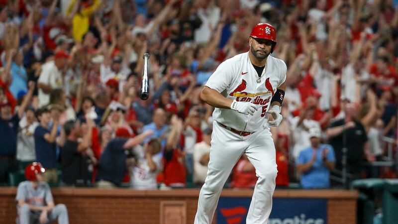 St. Louis Cardinals' Albert Pujols tosses his bat after hitting a two-run home run during the...
