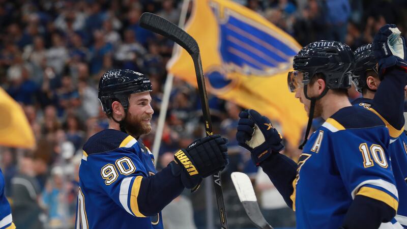 St. Louis Blues' Ryan O'Reilly (90) and Brayden Schenn (10) celebrate after the Blues defeated...