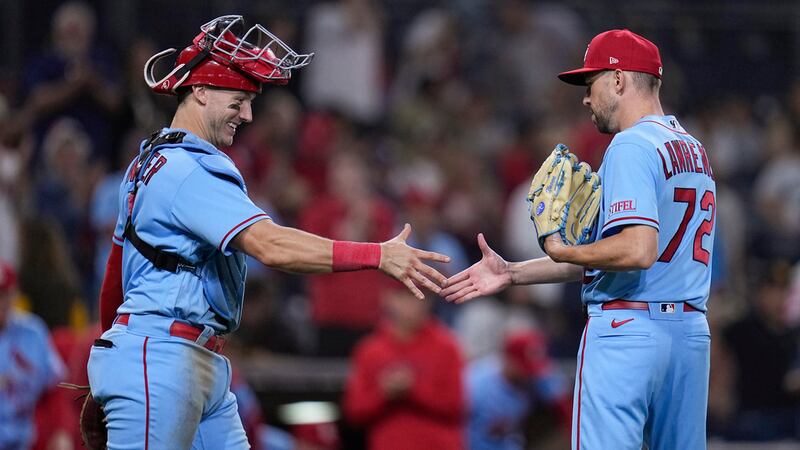 St. Louis Cardinals relief pitcher Casey Lawrence, right, celebrates with catcher Andrew...