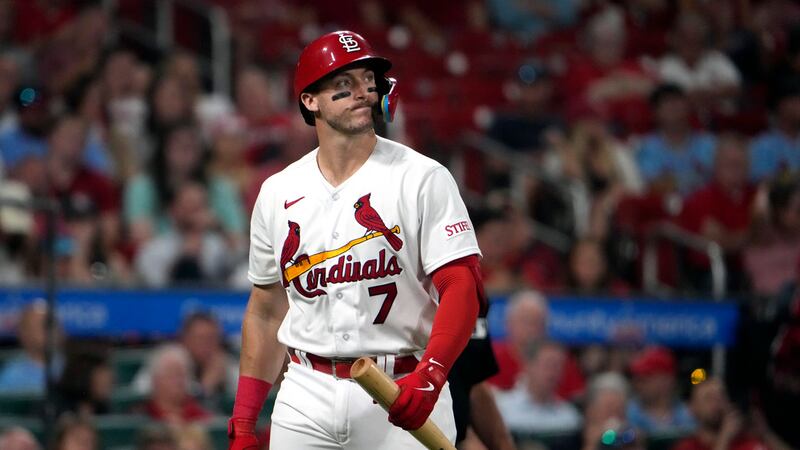 St. Louis Cardinals' Andrew Knizner walks back to the dugout after striking out with the bases...