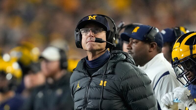 Michigan head coach Jim Harbaugh watches against Purdue in the first half of an NCAA college...