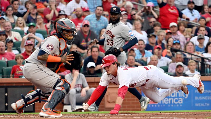 St. Louis Cardinals second baseman Nolan Gorman (16) slides safety into home in the first...