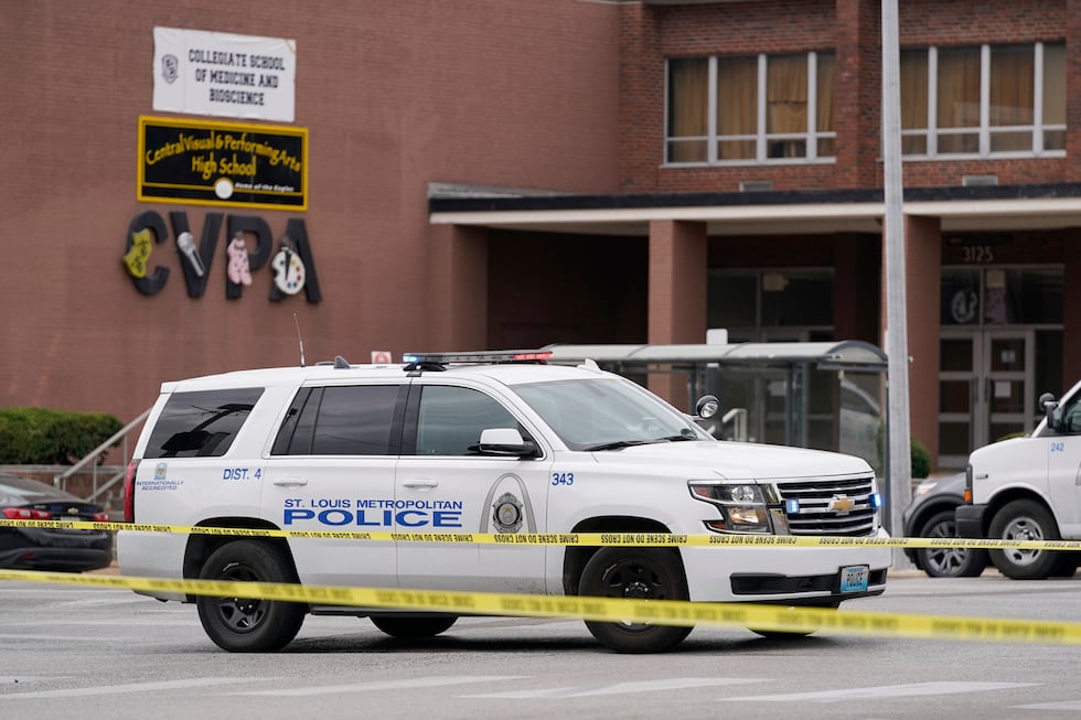 Law enforcement investigate the scene of a shooting at Central Visual and Performing Arts High...